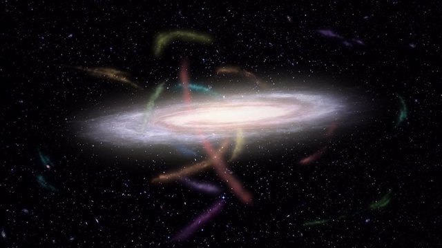Representación artística de nuestra galaxia, la Vía Láctea, rodeada de decenas de corrientes estelares (resaltadas en colores). Eran las galaxias satélite compañeras o cúmulos globulares que ahora están siendo destrozados por la gravedad galáctica.