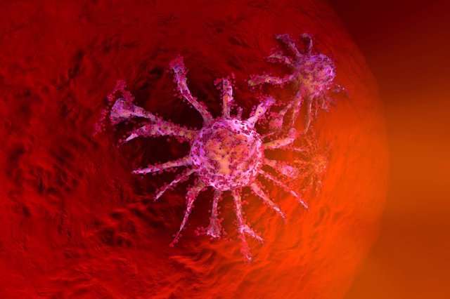 Archivo - Una célula cancerosa en crecimiento que se disemina sobre el tejido sano. Metástasis