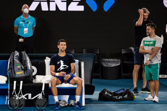 Novak Djokovic of Serbia (centre) during a practice session ahead of the Australian Open at Melbourne Park in Melbourne, Friday, January 14, 2022. (AAP Image/Diego Fedele) NO ARCHIVING