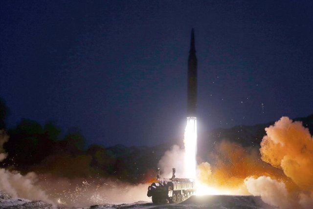 HANDOUT - 11 January 2022, North Korea, ---: A picture provided by the North Korean Central News Agency (KCNA) shows a missile launching from a mobile launch pad. North Korea's National Defence Academy said it was a test launch of a hypersonic missile. Ph