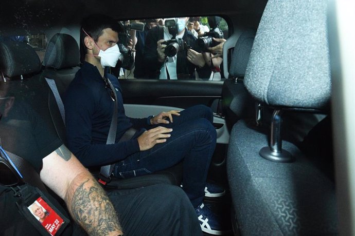 Serbian tennis player Novak Djokovic (centre) departs from the Park Hotel government detention facility before attending a court hearing at his lawyers office in Melbourne, Sunday, January 16, 2022. Novak Djokovic still faces uncertainty as to whether h