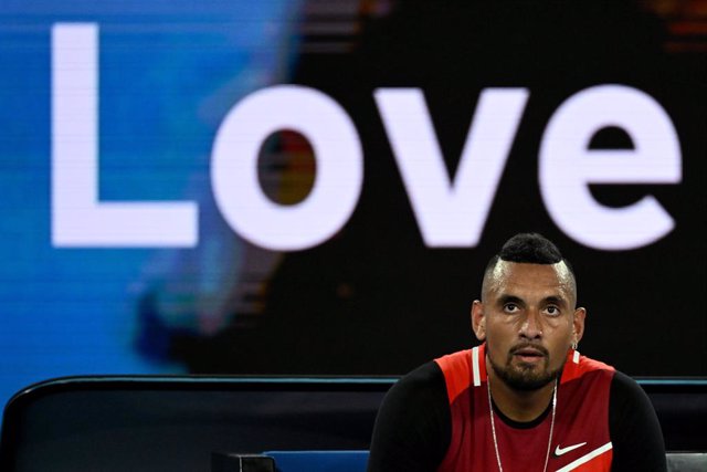 Nick Kyrgios of Australia sits during a set break in his second round Men’s singles match against Daniil Medvedev of Russia on day 4 of the Australian Open at Melbourne Park in Melbourne, Thursday, January 20, 2022. (AAP Image/Dean Lewins) NO ARCHIVING, E