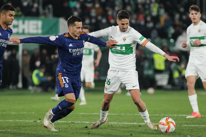 Lucas Vazquez of Real Madrid and Fidel Chaves de la Torre of Elche in action during Copa del Rey football match played between Elche CF and Real Madrid at Martinez Valero stadium on January 20, 2022, in Elche, Alicante, Spain.
