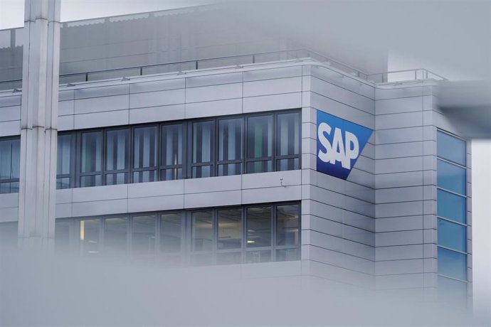 FILED - 26 January 2022, Walldorf: A logo of the software company SAP can be seen through a pane on the main building. Fourth quarter profit after tax declined 25 per cent to 1.45 billion euros (1.64 billion dollars) at German cloud-based software compa