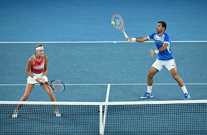 Ivan Dodig of Croatia (right) and Kristina Mladenovic of France during their Mixed Doubles Final against Jaimee Fourlis and Jason Kubler of Australia on Day 12 of the Australian Open, at Melbourne Park, in Melbourne, Friday, January 28, 2022. (AAP Image