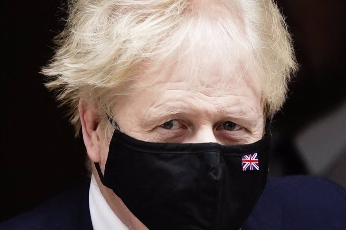 26 January 2022, United Kingdom, London: UK Prime Minister Boris Johnson leaves 10 Downing Street, London, to attend Prime Minister's Questions at the Houses of Parliament. Photo: Aaron Chown/PA Wire/dpa
