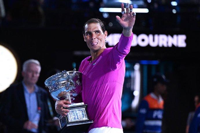 Rafael Nadal of Spain holds the Norman Brookes Challenge Cup after winning the mens singles final against Daniil Medveded of Russia on Day 14 of the Australian Open at Melbourne Park in Melbourne, Sunday, January 30, 2022. (AAP Image/Dave Hunt) NO ARCH