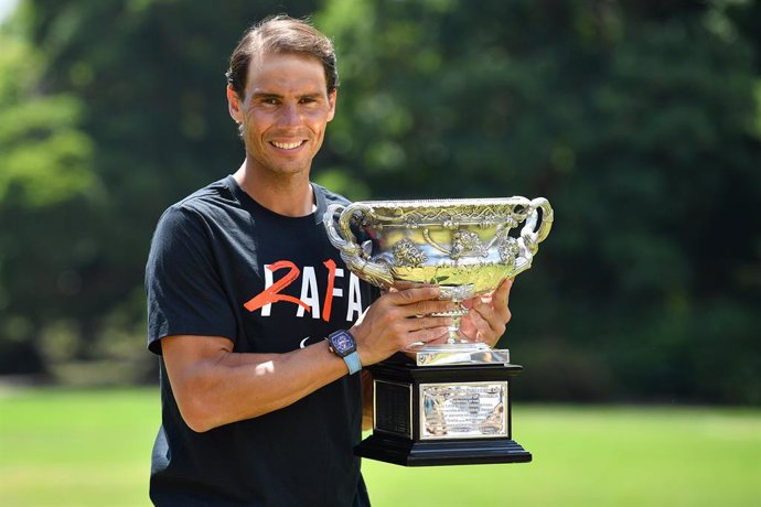 Rafael Nadal of Spain poses for a photograph with the Norman Brookes Challenge Cup in Melbourne, Monday, January 31, 2022. Nadal won a record 21st Grand Slam and his second Australian Open title on Sunday after a thrilling five set victory over Daniil M