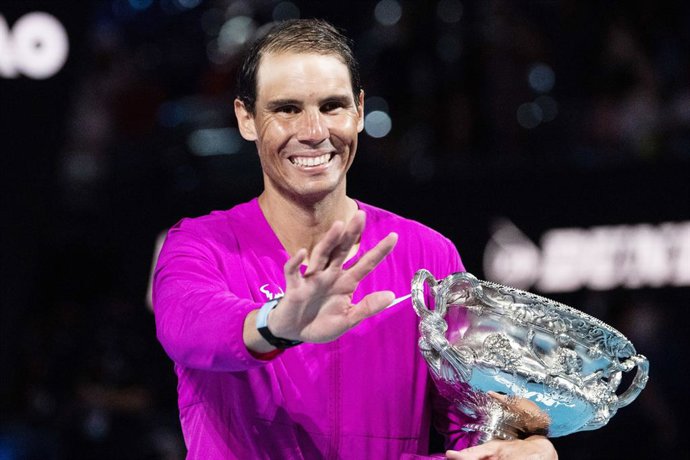Rafael Nadal from Spain celebrates winning with he trophy his Men's Singles Finals match against Daniil Medvedev from Russia at the 2022 Australian Open, Grand Slam tennis tournament on January 30, 2022 at Melbourne Park in Melbourne, Australia - Photo 