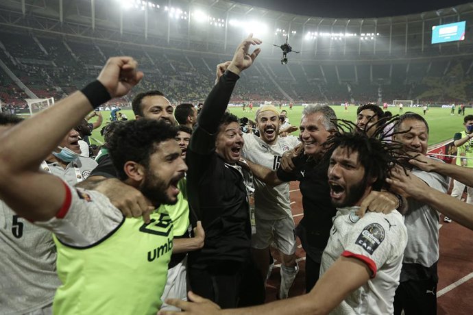 03 February 2022, Cameroon, Yaounde: Egypt players celebrate after the final whistle of the 2021 Africa Cup of Nations Semi-Final soccer match between Cameroon and Egypt at the Paul Biya 'Olembe' Stadium. Photo: Ayman Aref/dpa