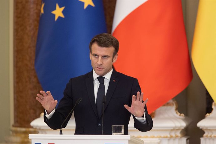 HANDOUT - 08 February 2022, Ukraine, Kiev: French President Emmanuel Macron speaks during a joint press conference with Ukrainian President Volodymyr Zelensky (not pictured) after their meeting. Photo: -/Ukrainian Presidency/dpa - ATTENTION: editorial u