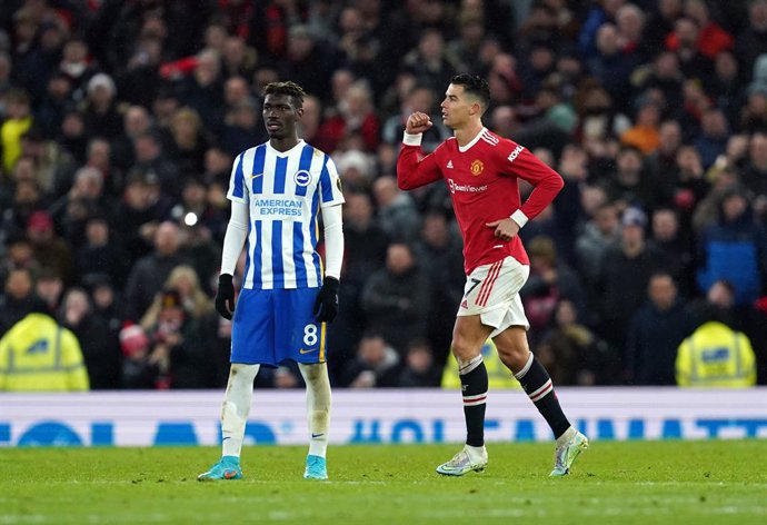 15 February 2022, United Kingdom, Manchester: Manchester United's Cristiano Ronaldo (R) celebrates scoring his side's first goal during the English Premier League soccer match between Manchester United and Brighton & Hove Albion at Old Trafford. Photo: 