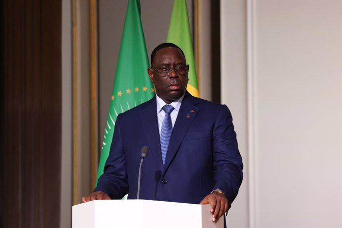 HANDOUT - 17 February 2022, France, Paris: Senegal's President Macky Sall speaks at joint press conference with Ghana's President Nana Afuko Addo, European Council President Charles Michel, and French President Emmanuel Macron,on France's engagement in 