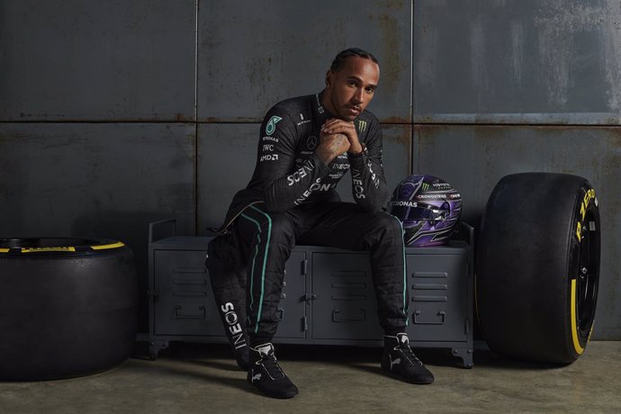 HANDOUT - 18 February 2022, United Kingdom, Silverstone: An undated handout photo made available on 18 February 2022 shows British Formula One driver Lewis Hamilton of Team Mercedes poses during the presentation of the new the Mercedes-AMG car, W13 E Pe