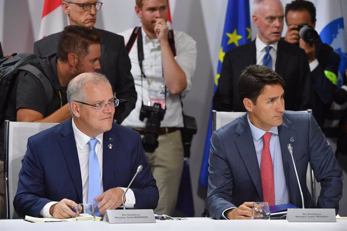 Archivo - 26 August 2019, France, Biarritz: Canadian Prime Minister Justin Trudeau (R) and Australian Prime Minister Scott Morrison attend a meeting on the last day of the G7 Summit. Photo: Mick Tsikas/AAP/dpa