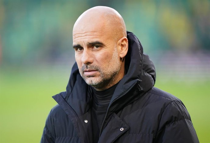 12 February 2022, United Kingdom, Norwich: Manchester City manager Pep Guardiola pictured prior to the start of the English Premier League soccer match between Norwich City and Manchester City at Carrow Road. Photo: Joe Giddens/PA Wire/dpa