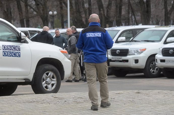 A member of the Organization for Security and Cooperation in Europe (OSCE) Special Monitoring Mission to Ukraine is seen in Donetsk, Ukraine. On February 24 Russian President Vladimir Putin announced a military operation in Ukraine following recognition