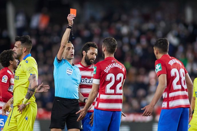 Domingos Duarte of Granada see the yellow card during the spanish league, La Liga Santander, football match played between Granada CF and Cadiz CF at Nuevo Los Carmenes stadium on February 28, 2022, in Granada, Spain.