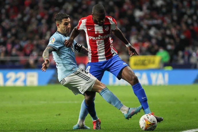 Hugo Mallo of Celta de Vigo and Geoffrey Kondogbia of Atletico de Madrid in action during the Spanish League, La Liga Santander, football match played between Atletico de Madrid and Celta de Vigo at Wanda Metropolitano stadium on February 26, 2022, in M