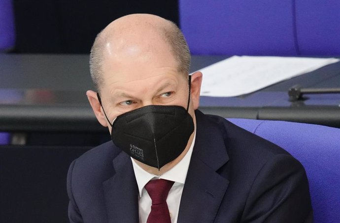27 February 2022, Berlin: German Chancellor Olaf Scholz listens to Friedrich Merz (not pictured), chairman of the Christian Democratic Union (CDU), while speaking during a special session of the German Bundestag on the Russia-Ukraine conflict. Photo: Ka