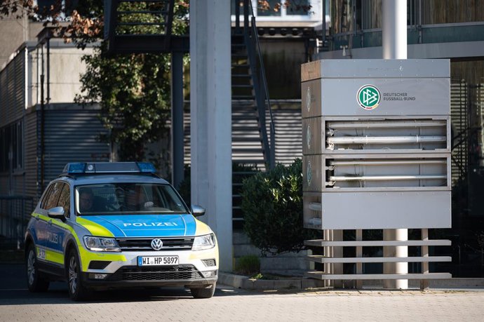 03 March 2022, Hessen, Frankfurt_Main: A police car drives by the headquarters of the German Soccer Association.  The German Football Federation (DFB) headquarters were searched by the authorities along with other objects on Thursday as part of a probe 