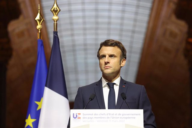 HANDOUT - 11 March 2022, France, Versailles: French President Emmanuel Macron speaks during a press conference at the Palace of Versailles after the meeting of the heads of states and governments of the EU to discuss the current developments after the Rus