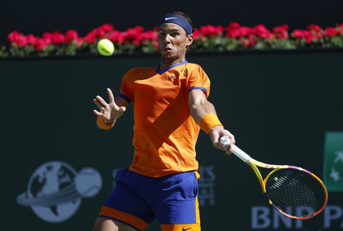 14 March 2022, US, Indian Wells: Spainsh tennis player Rafael Nadal returns a shot against UK's Daniel Evans during their Men's Singles Round of 32 Tennis match of the Indian Wells Masters tennis tournament at Indian Wells Tennis Garden. Photo: Charles 