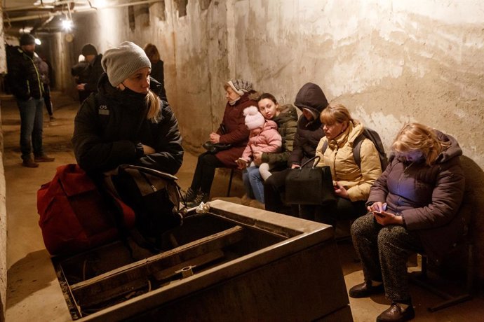 12 March 2022, Ukraine, Uzhhorod: People stay in a bomb shelter after the first air raid siren goes off in Uzhhorod, during the third week of the Russian invasion of Ukraine. Photo: -/Ukrinform/dpa