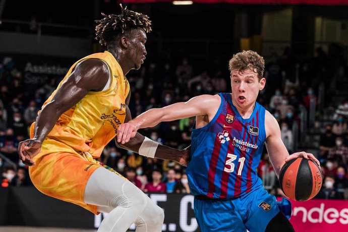 Rokas Jokubaitis of FC Barcelona in action against Khalifa Diop of Gran Canaria  during the ACB Liga Endesa match between FC Barcelona and Gran Canaria at Palau Blaugrana on March 20, 2022 in Barcelona, Spain.