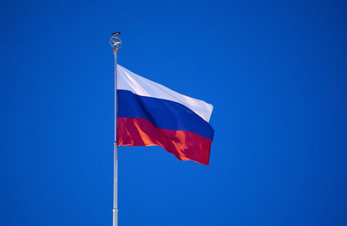 01 March 2022, Berlin: A flag of the Russian Federation flies over the Russian Embassy in Berlin. Photo: Christophe Gateau/dpa