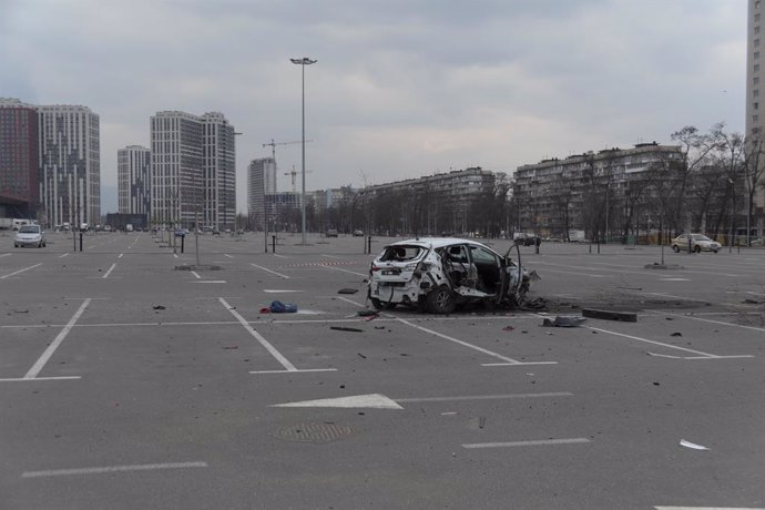 March 24, 2022, Kyiv, Kyiv Oblast, Ukraine: A car is damaged by Russian shelling in the Retroville mall parking lot. Russian Journalist Oksana Baulina and a civilian were killed nearby the car. Baulina was working for for investigative website The Insid