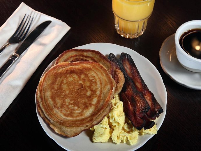 Sourdough Pancakes with 2 eggs and House Bacon.