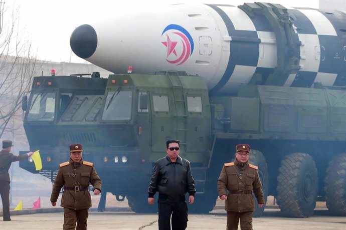 24 March 2022, North Korea, Pyongyang: A photo released by North Korea's official Korean Central News Agency shows North Korean leader Kim Jong-un (C) visiting Pyongyang International Airport, to inspect the launch of a Hwasong-17 intercontinental balli