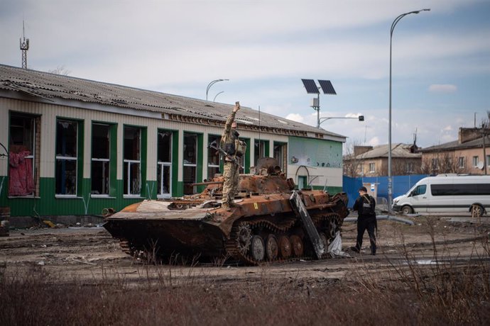 April 7, 2022, Borodyanka, Ukraine: A soldier stands on top of a tank in Borodyanka, a town outside of Kyiv that was recently liberated from Russian occupation.,Image: 681070530, License: Rights-managed, Restrictions: , Model Release: no, Credit line: L