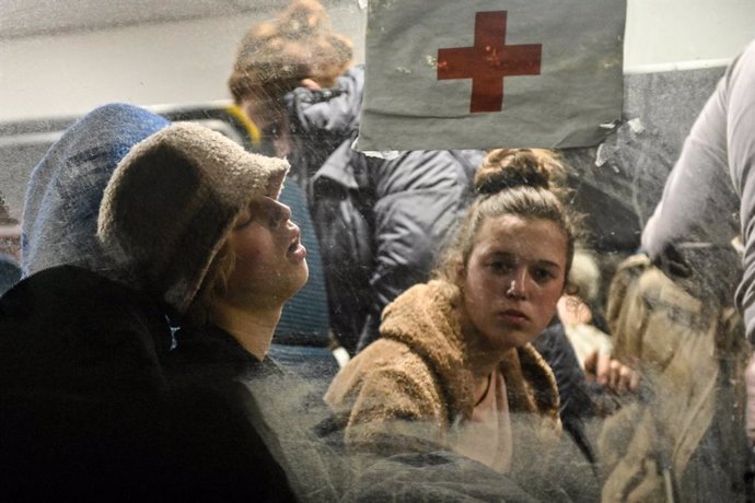 01 April 2022, Ukraine, Zaporizhzhia: People evacuated from Melitopol via a humanitarian corridor, stay in a bus upon their arrival to the southeastern city of Zaporizhzhia. Photo: -/Ukrinform/dpa