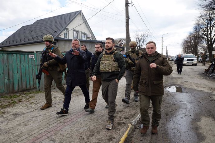04 April 2022, Ukraine, Bucha: Ukrainian President Volodymyr Zelensky visits the town of Bucha in Kyiv Region, where mass killings of civilians occurred during the occupation by Russian troops. Photo: -/ZUMA Press Wire Service/dpa