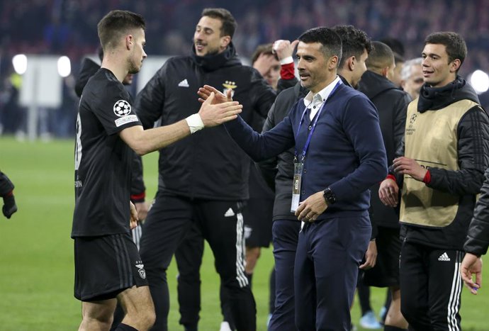 Coach of Benfica Nelson Verissimo and Julian Weigl (left) celebrate the victory and the qualification following the UEFA Champions League, Round of 16, 2nd leg football match between AFC AJAX Amsterdam and SL Benfica Lisbon on March 15, 2022 at Johan Cr