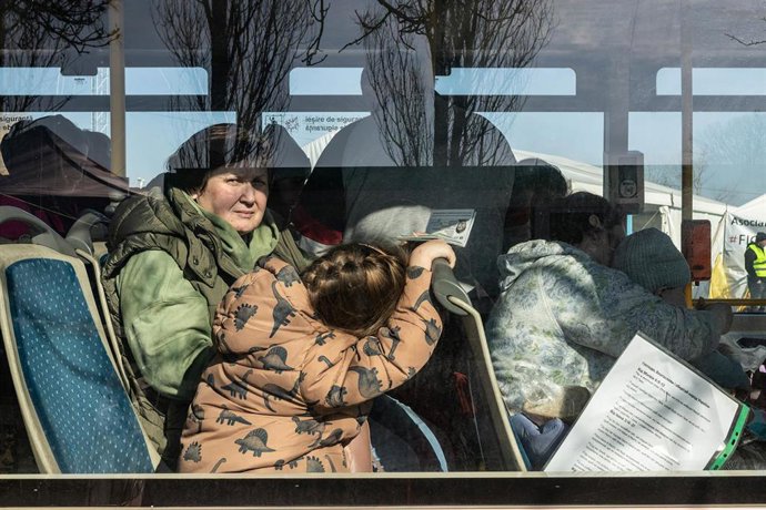 March 18, 2022, Siret, Romania: A woman with a passport in hand is on board a bus waiting to enter Central Europe. About 3 thousand people arrive daily in Siret, Romania to take refuge from the violence caused by the war between Russia and Ukraine. In t