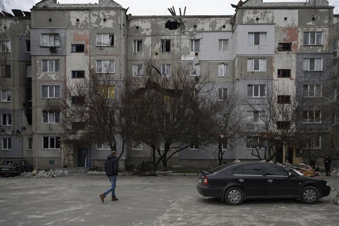 April 12, 2022, Makariv, Kyiv, Ukraine: A man seen walking in a damaged compound. The village of Makariv, west of Kyiv, presents evident signs of damages during the Russians occupation, lasted until the end of March 2022. Residents try to cope with the