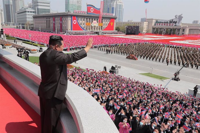 HANDOUT - 15 April 2022, North Korea, Pyongyang: A picture provided by the North Korean state news agency (KCNA) on 16 April 2022, shows North Korean leader Kim Jong-un waving during a national ceremony and a rally of Pyongyang citizens held simultaneou