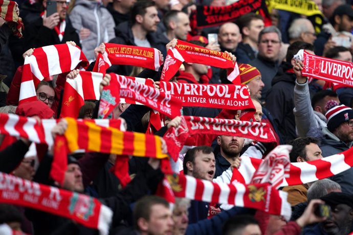 02 April 2022, United Kingdom, Liverpool: Liverpool fans cheer in the stands during the English Premier League soccer match between Liverpool and Watford at the Anfield Stadium. Photo: Peter Byrne/PA Wire/dpa