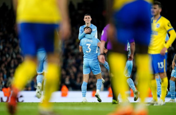 20 April 2022, United Kingdom, Manchester: Manchester City's Phil Foden celebrates scoring his side's second goal during the English Premier League soccer match between Manchester City and Brighton & Hove Albion at the Etihad Stadium. Photo: Martin Rick