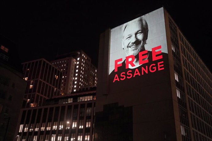 10 April 2022, United Kingdom, London: An image of Julian Assange projected onto a building in Leake Street in central London, to mark three years since his arrest and detention in Belmarsh prison while the United States continues with legal moves to ex