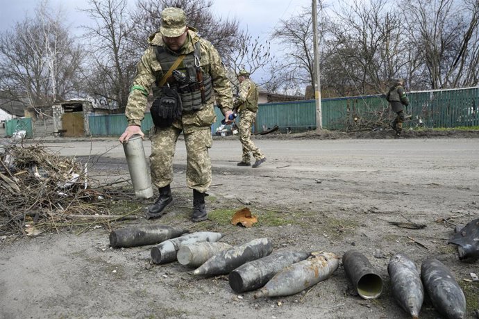 April 12, 2022, Andriivka, Kyiv, Ukraine: A man from security forces is seen leaving parts of used weapons. The village of Andriivka, west of Kyiv, revealed heavy damages, civilian killings and disappearing, after the Russian withdrawal at the end of Ma