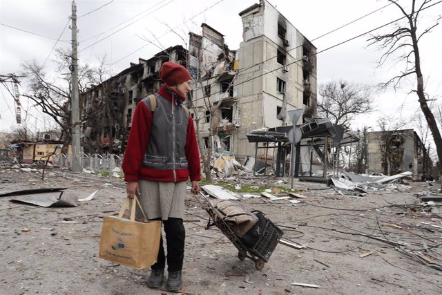 MARIUPOL, April 19, 2022  -- A resident walks near damaged buildings in Mariupol on April 18, 2022.,Image: 684196456, License: Rights-managed, Restrictions: , Model Release: no, Credit line: Bai Xueqi / Xinhua News / ContactoPhoto Editorial licence valid 
