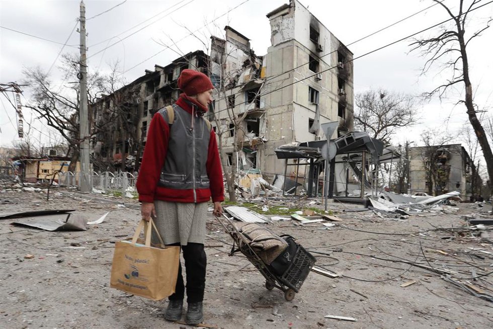 MARIUPOL, April 19, 2022  -- A resident walks near damaged buildings in Mariupol on April 18, 2022.,Image: 684196456, License: Rights-managed, Restrictions: , Model Release: no, Credit line: Bai Xueqi / Xinhua News / ContactoPhoto Editorial licence vali
