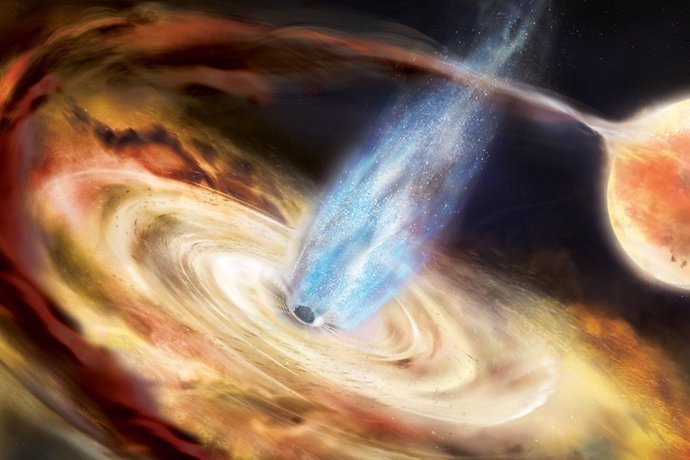 En esta ilustración, un agujero negro extrae material de una estrella vecina y lo deposita en un disco de acreción.