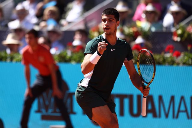 Carlos Alcaraz of Spain in action against Novak Djokovic of Serbia during the Mutua Madrid Open 2022 celebrated at La Caja Magica on May 07, 2022, in Madrid, Spain.