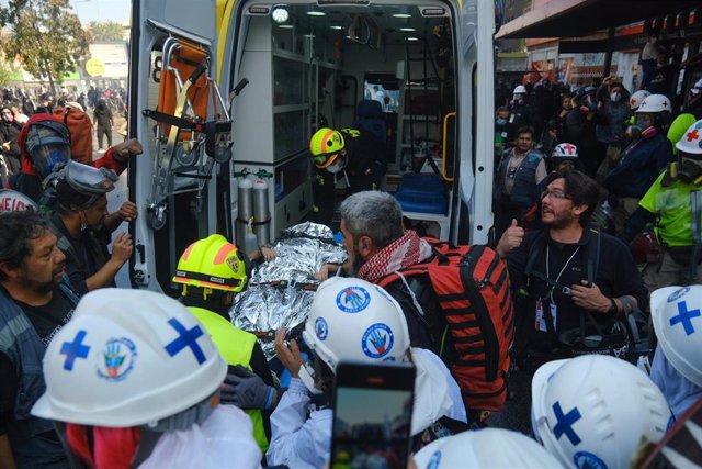 01 May 2022, Chile, Santiago: A person is hospitalized after being shot during clashes between protesters and police following a demonstration marking the International Labour Day (May Day) in the centre of the Chilean capital Santiago