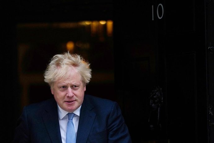13 May 2022, United Kingdom, London: British Prime Minister Boris Johnson walks to receive Norway's Prime Minister Jonas Gahr Store at 10 Downing Street in London. Photo: Victoria Jones/PA Wire/dpa